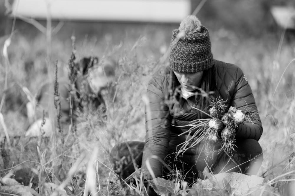 A participant holds onions at the SAP (b&w).
